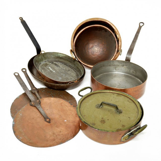A GROUP OF NINE ITALIAN COPPER COOKING UTENSILS: A GROUP OF NINE ITALIAN COPPER COOKING UTENSILS, late 19th or early 20th Century most having iron handles; includes a fish poacher skillet, covered baker, 2 flat skillets, a deep skillet, two bowls, a