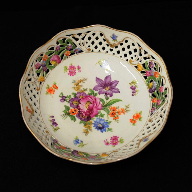A RETICULATED SCHUMANN BAVARIAN CHINA BOWL: A RETICULATED SCHUMANN BAVARIAN CHINA BOWL pattern "Chateau Dresden", now discontinued Circa 1945-1963; with panted florals to the rim and center; gilt accents 2 1/2 x 10 x 10 inches