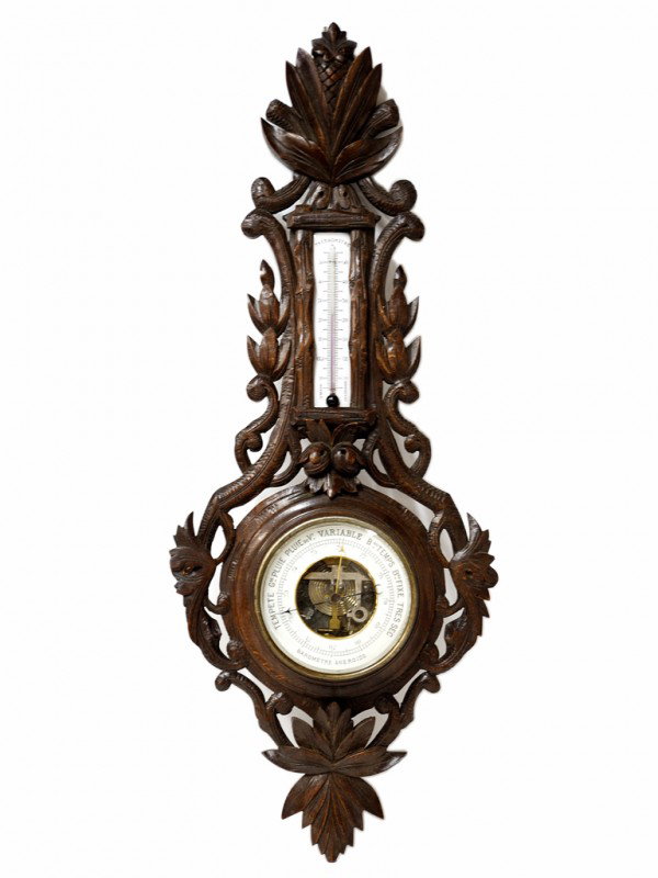 A BLACK FOREST OAK BAROMETER: A BLACK FOREST OAK BAROMETER 28 x 11 x 3 inches