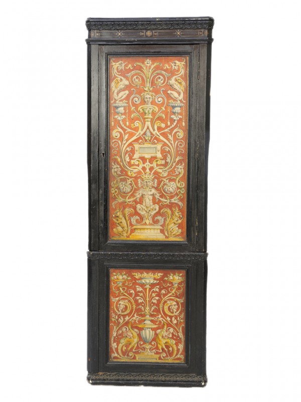 A FRENCH RENAISSANCE BAROQUE STYLE EBONIZED CORNER: A FRENCH RENAISSANCE BAROQUE STYLE EBONIZED CORNER CABINET, France Nineteenth Century and later moulded flat cornice rests upon a floral carved moulding and handpainted frieze above the two panel door