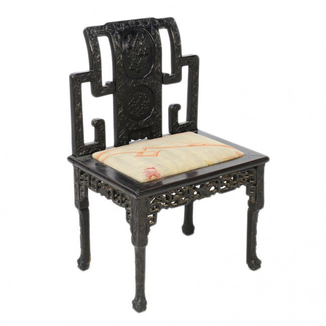 A CHINESE RELIEF CARVED EBONIZED TEAK CHAIR, China: A CHINESE RELIEF CARVED EBONIZED TEAK CHAIR, China Last Quarter Nineteenth Century and later now fitted with 19th century Aubusson upholstered drop-in seat, originally for an inset marble seat; steppe