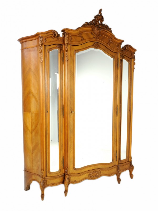 A LOUIS XV WALNUT TRIPLE DOOR ARMOIRE: A LOUIS XV WALNUT TRIPLE DOOR ARMOIRE beveled mirror, serpentine sides 104 x 65 x 18 inches