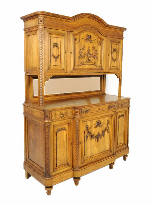 A LOUIS XVI STYLE CARVED WALNUT BUFFET DEUX CORPS: A LOUIS XVI STYLE CARVED WALNUT BUFFET A DEUX CORPS beveled mirror, of slight breakfront form, the lower ease comprised of 3 drawers and 3 doors 82 x 60 x 23 inches