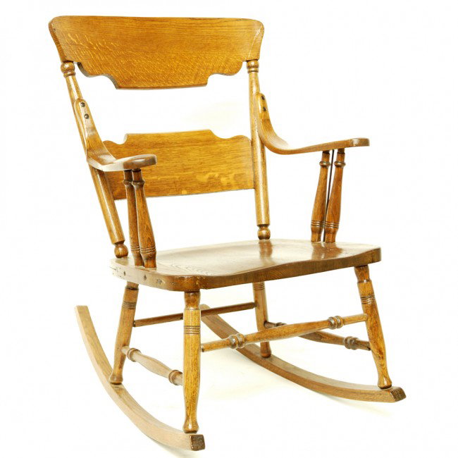 AN AMERICAN OAK ROCKING CHAIR: AN AMERICAN OAK ROCKING CHAIR 35 x 20 3/4 x 18 inches