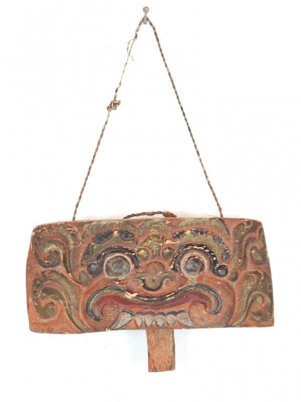 AN ANTIQUE WOOD CARVED BALINESE BELL DEPICTING A BA: AN ANTIQUE WOOD CARVED BALINESE BELL DEPICTING A BARONG The people of Bali, Indonesia, perform numerous traditional dances. The dance most popular with tourists is the Barong & Rangda, a battle betwee