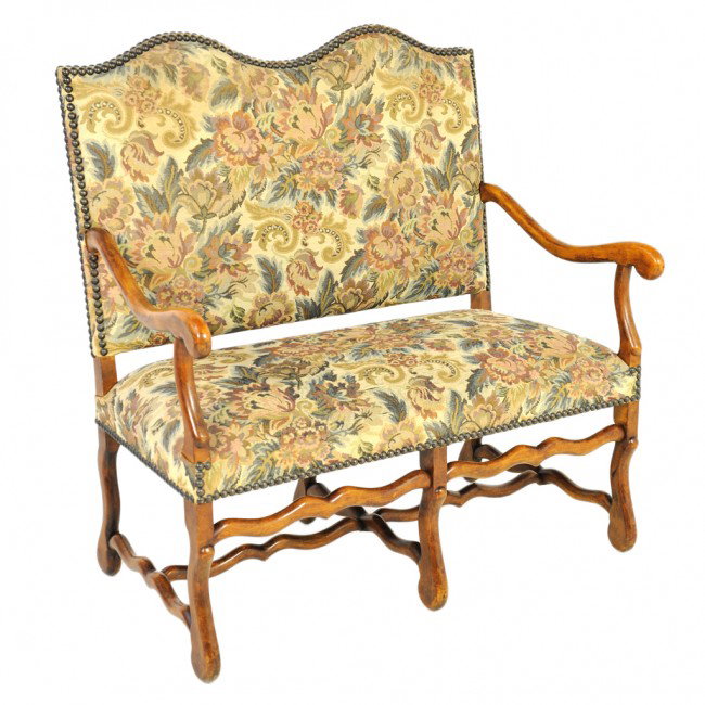 A SHEEP BONE STYLE OAK AND UPHOLSTERED SETTEE: A SHEEP BONE STYLE OAK AND UPHOLSTERED SETTEE 43 1/2 x 42 x 23 inches