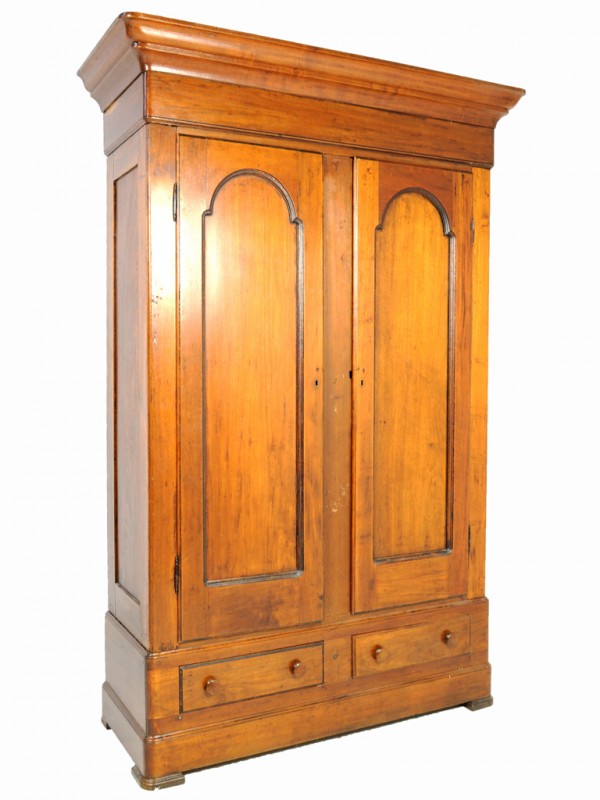 AN AMERICAN MAHOGANY ARMOIRE, Nineteenth Century: AN AMERICAN MAHOGANY ARMOIRE, Nineteenth Century with two large doors and two small lower drawers; the doors with inset arched beveled panels; some scuffs and damage to interior 91 x 62 x 23 inches