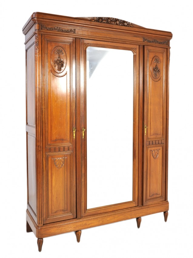 A LOUIS XVI STYLE WALNUT TRIPLE DOOR ARMOIRE: A LOUIS XVI STYLE WALNUT TRIPLE DOOR ARMOIRE beveled mirror 89 1/2 x 62 1/2 x 20 1/2 inches
