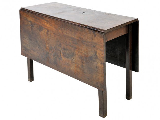 A TEAKWOOD DROP LEAF TABLE: A TEAKWOOD DROP LEAF TABLE 28 x 51 1/2 x 42 inches