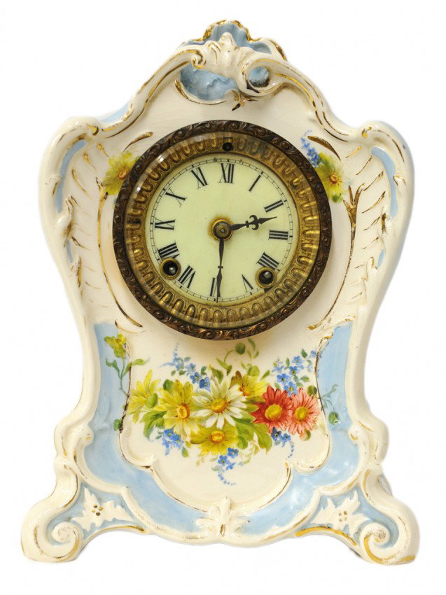 A ROYAL BONN "LA BONITA" PORCELAIN MANTEL CLOCK, La: A ROYAL BONN "LA BONITA" PORCELAIN MANTEL CLOCK Late Nineteenth Century / Early Twentieth Century with red Royal Bonn stamp to back featuring a crown over a shield monogrammed with "JM" and marked "17