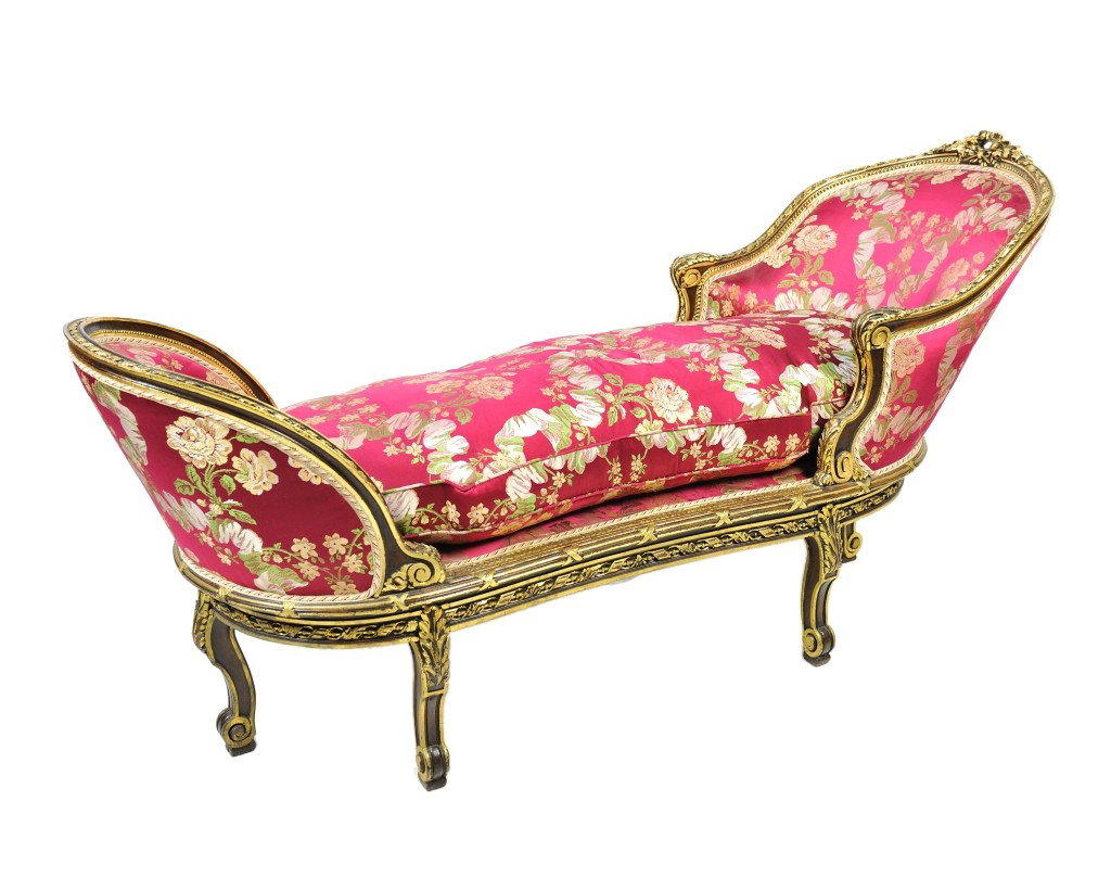 A LOUIS XV WALNUT DUCHESSE, France, Circa 1866: A LOUIS XV WALNUT DUCHESSE France Circa 1866 The bergere type backrest with floral wreath at crest and carved and gilded ribbon border and scrolled armrests the footrest and seat rails also with carve