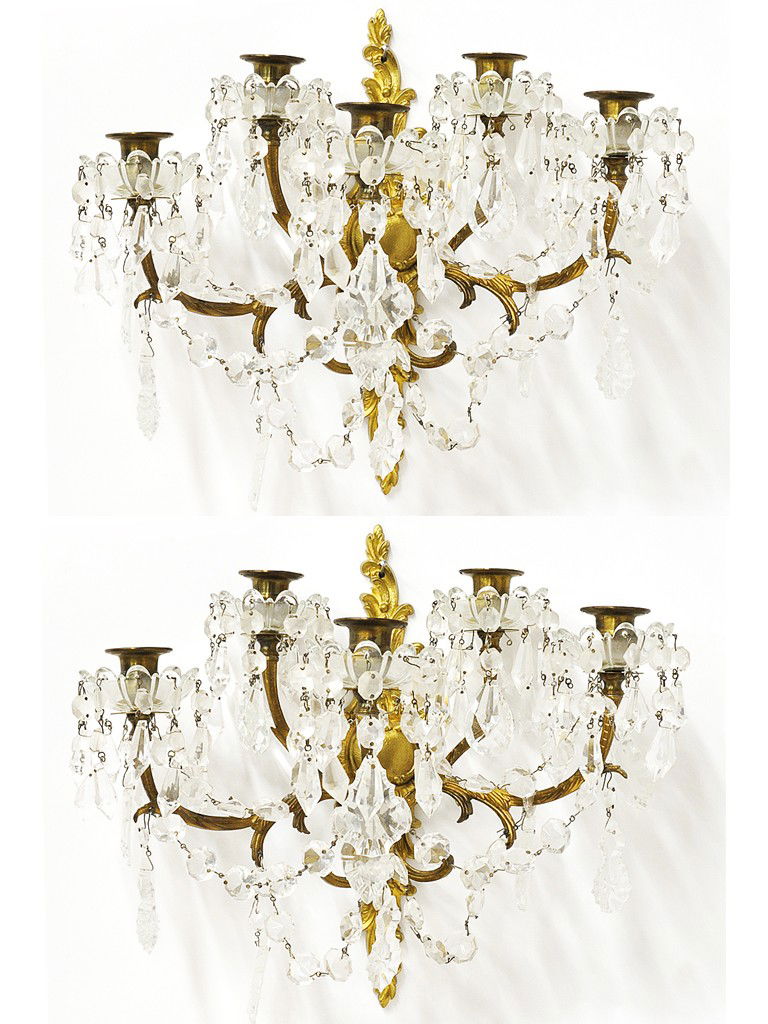 A PAIR GILT BRASS FIVE-LIGHT WALL SCONCES / CANDLE: A PAIR GILT BRASS FIVE-LIGHT WALL SCONCES / CANDLEHOLDERS with foliate scroll arms; crystal garlands and faceted short crystal icicles dangling from crystal cups 2 pieces 14 1/2 x 9 x 4 1/2 inches