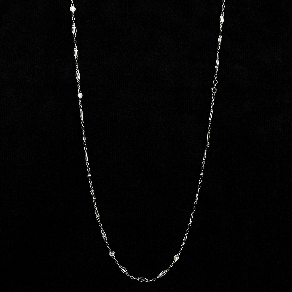 PLATINUM DIAMONDS BY THE YARD NECKLACE: PLATINUM DIAMONDS BY THE YARD NECKLACE 18" in length. bezel set with 7 circular cut diamonds = 1.00 Ct., G SI2. 7.8 grams. Condition: nearly every link needs rebuilt. Currently with two breaks.