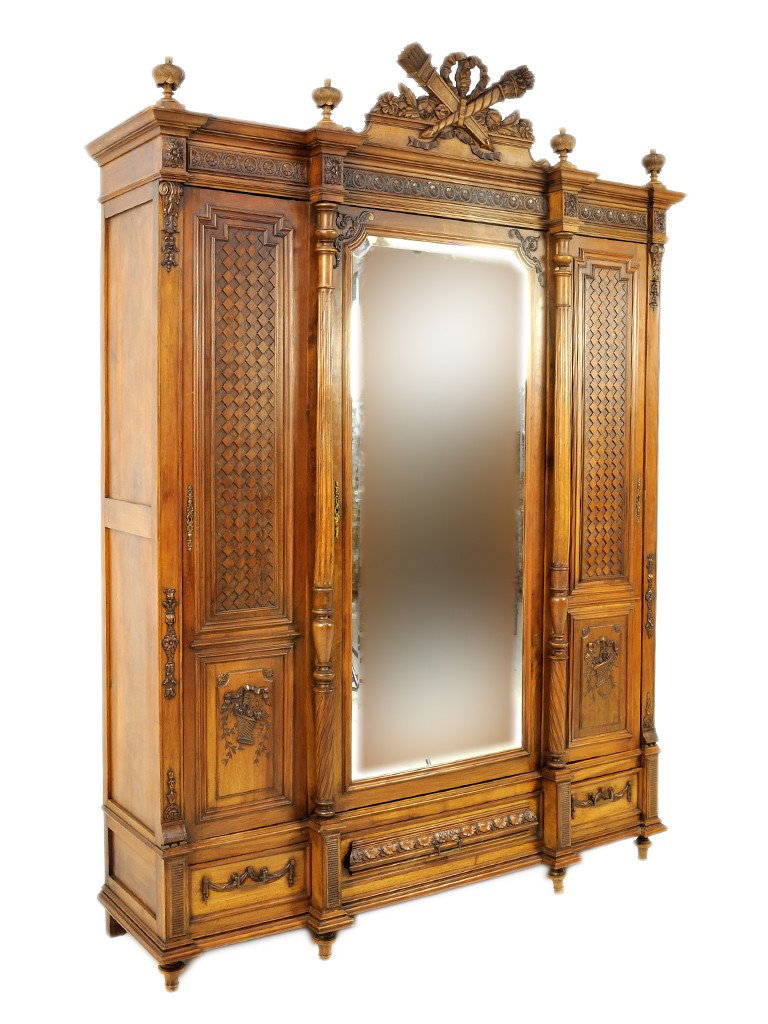 A WELL CARVED ANTIQUE FRENCH TRIPLE DOOR MIRRORED : A WELL CARVED ANTIQUE FRENCH TRIPLE DOOR MIRRORED ARMOIRE Circa 1890 with superbly carved door panels fitted with interior shelves 97 x 89 x 19 inches