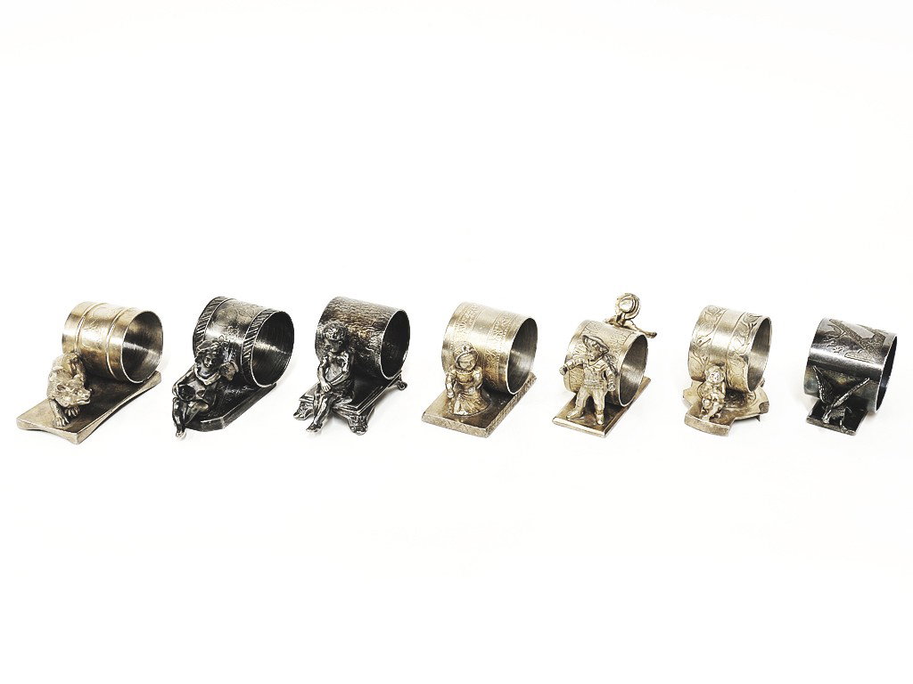 AN ASSEMBLED COLLECTION OF SILVER PLATE VICTORIAN N: AN ASSEMBLED COLLECTION OF SILVER PLATE VICTORIAN NAPKIN RINGSwith various figures and makers: Middletown; EG Webster & Son; Pairpoint MFG Co.; Meriden and two indecipherable maker's marks 7 pieces 2 