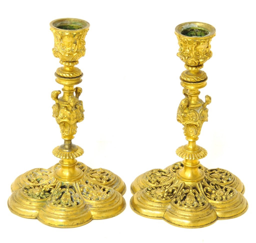 A PAIR OF FINELY CRAFTED FRENCH DORÉ BRONZE RETICULATED: A PAIR OF FINELY CRAFTED FRENCH DORÉ BRONZE RETICULATED CANDLESTICKS France, Nineteenth Century The finely crafted bronze candlesticks with three female busts to waisted circular stem supporting a ch