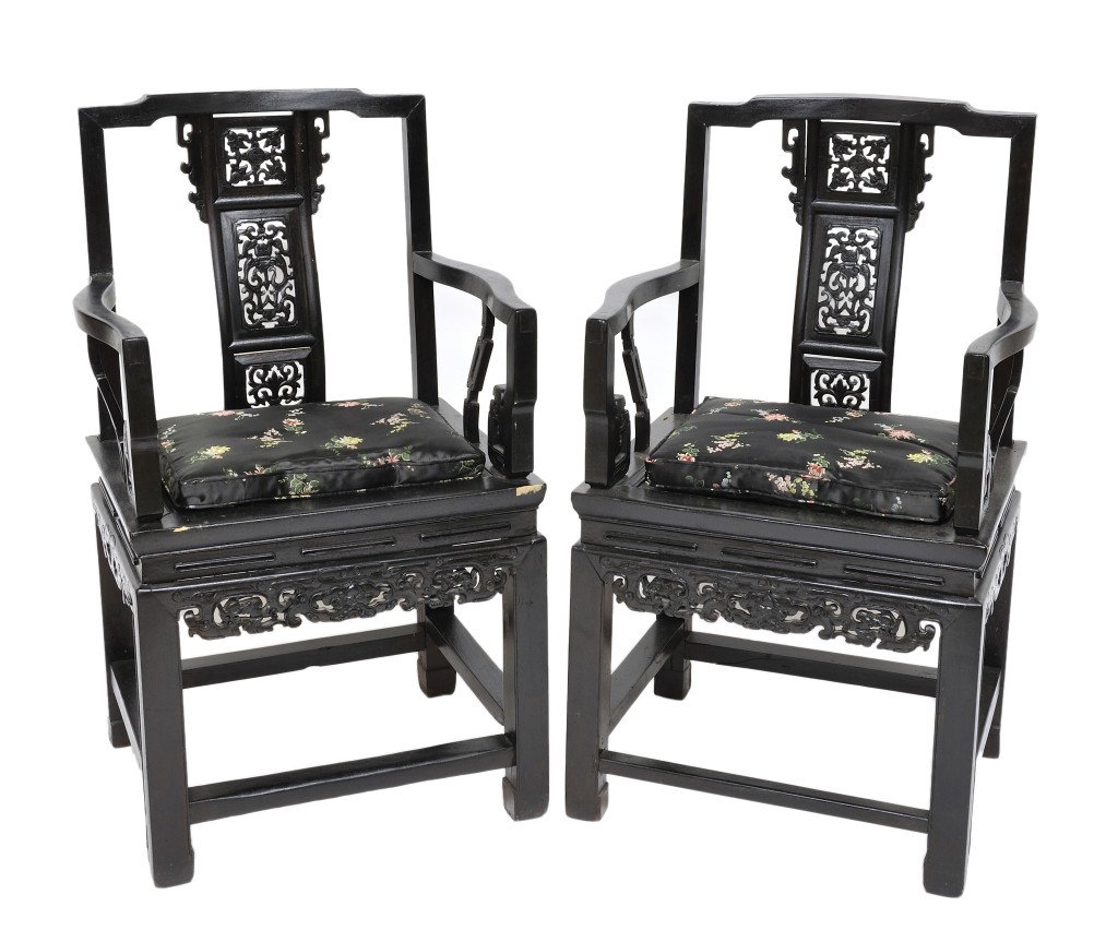 A PAIR OF CHINESE HONGMU ARMCHAIRS China, Early Ninetee: A PAIR OF CHINESE HONGMU ARMCHAIRS China, Early Nineteenth Century Each chair having a humped toprail joined to a vertical pierce-carved backsplat divided into three panels depicting primarily bats fl