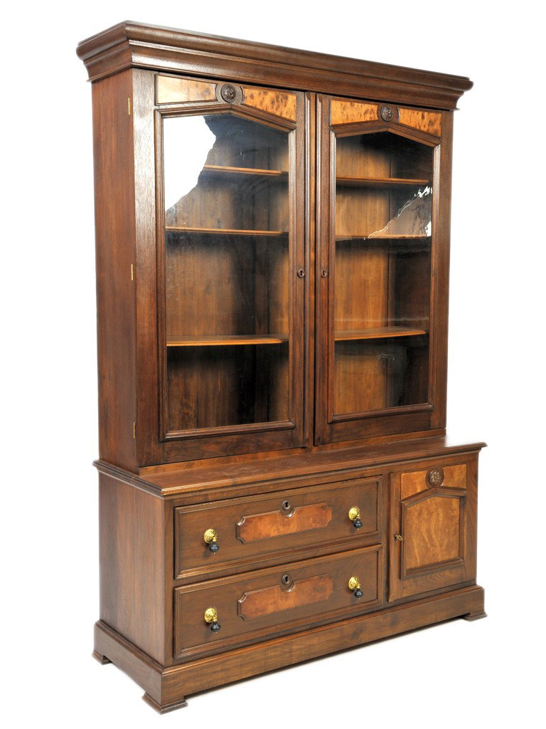 AMERICAN EASTLAKE WALNUT AND BURL WALNUT STEP-BACK : AMERICAN EASTLAKE WALNUT AND BURL WALNUT STEP-BACK BOOKCASE, 19th CENTURYthe moulded cornice above the two original glassed doors; the ogee beveled edge case contains two drawers, one cabinet door; sh