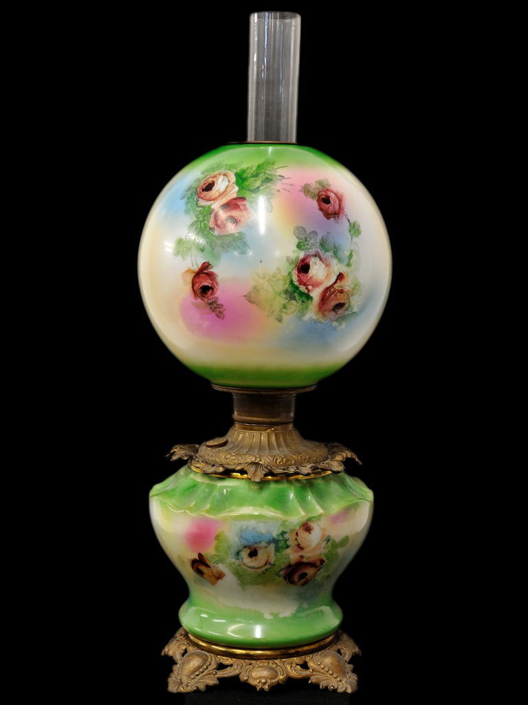 AN AMERICAN VICTORIAN "GONE WITH THE WIND" HAND PAI: AN AMERICAN VICTORIAN ""GONE WITH THE WIND"" HAND PAINTED OIL TABLE LAMP, 19th Centurykerosene-type; with green and white hand painted floral glass globe and base 24 x 10 x 10 inches