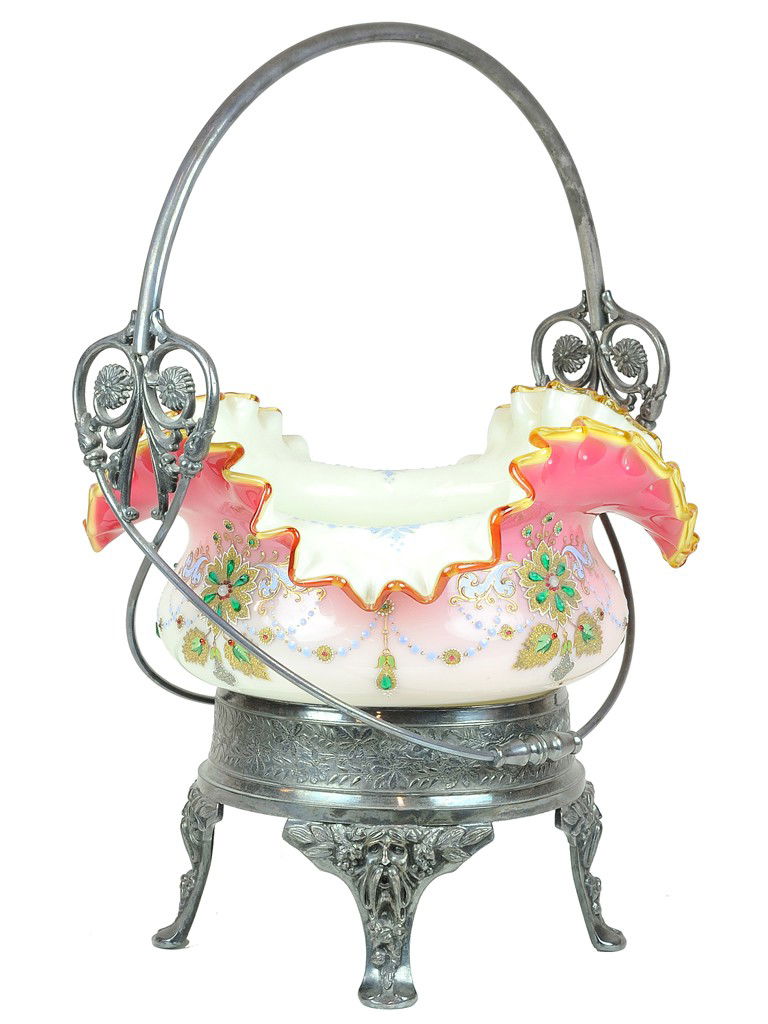 A VICTORIAN ANTIQUE BRIDES BASKET BOWL ON ORNATE H: A VICTORIAN ANTIQUE BRIDES BASKET BOWL ON ORNATE HOLDERthe ruffle rim cased bowl on a stand with handle and decorative case metal base. 15 x 11 x 9 inches