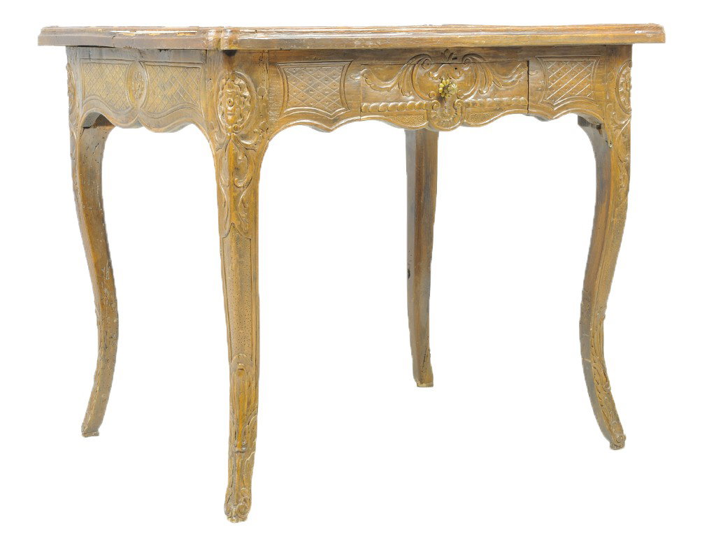 A LOUIS XV STYLED CARVED WALNUT CENTER / SIDE TABL: A LOUIS XV STYLED CARVED WALNUT CENTER / SIDE TABLE France, late 18th Century the shaped, double ogee beveled moulded edge rectangular top accented by relief carved shells at each corner above the rel