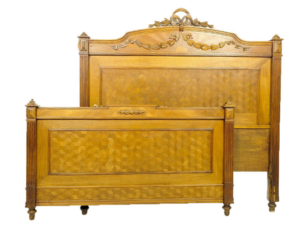 A LOUIS XVI WALNUT BED: A LOUIS XVI WALNUT BED length 73 in; width 52 1/2 in