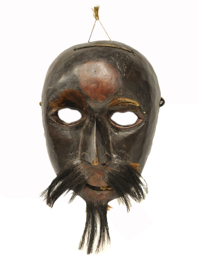 HINDU CARVED WOOD FACE MASK; Early 1900's: HINDU CARVED WOOD FACE MASK; Early 1900's From Nepal. The ovoid mask having eye and mouth openings, a sharp nose with pierced nostrils, and glued on monkey(?) hair eyebrows, moustache, and goatee; wit