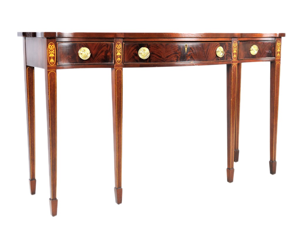 A GEORGE III STYLE MAHOGANY AND MARQUETRY SERPENTI: A GEORGE III STYLE MAHOGANY AND MARQUETRY SERPENTINE SIDEBOARD, Made by Councill Crafstmen, 20th Century with three drawers; inlaid with bows hung with tassels; flame figured veneered paneling; minor 