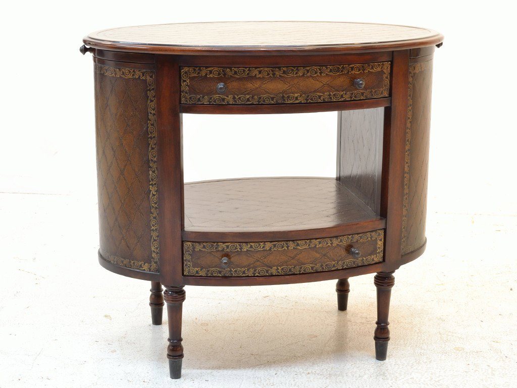 A WALNUT AND LEATHER OVAL SIDE TABLE BY THEODORE AL: A WALNUT AND LEATHER OVAL SIDE TABLE BY THEODORE ALEXANDER 2 drawers and a pull out on each side 29 x 32 x 20 inches