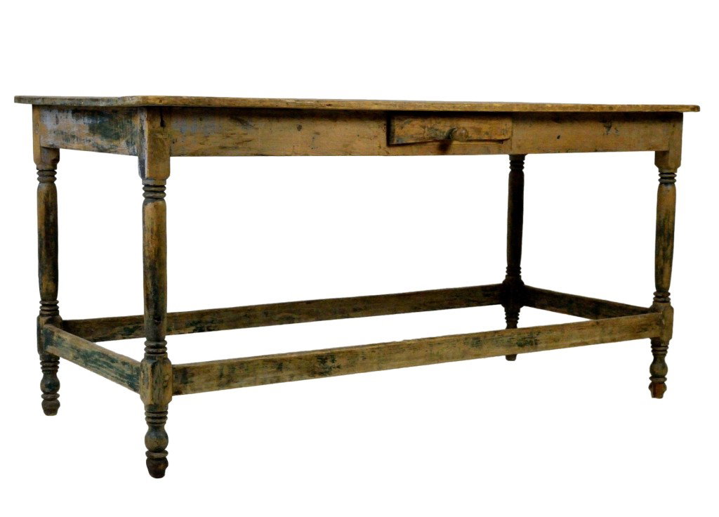 AN ANTIQUE PINE FARM TABLE: AN ANTIQUE PINE FARM TABLE With remnants of older paint. Possibly Mexican. 31 x 64 x 29-1/2 inches
