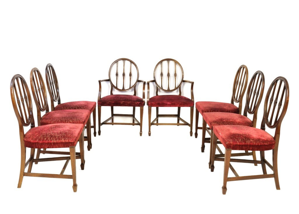 A GOOD SET OF EIGHT HEPPLEWHITE STYLE MAHOGANY CHA: A GOOD SET OF EIGHT HEPPLEWHITE STYLE MAHOGANY CHAIRS, England, Late 19th Century the oval moulded back rest surrounding the reeded and waisted vertical ladders with carved bas-relief oval rosettes he