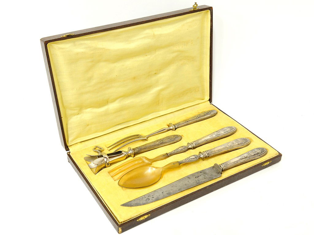 A UNIQUE LOUIS XVI STYLE STERLING SERVING SET Franc: A UNIQUE LOUIS XVI STYLE STERLING SERVING SET France, Nineteenth Century The French sterling handled suite having a hand embossed and engraved design of a be-ribboned flaming torch surrounded by flowe