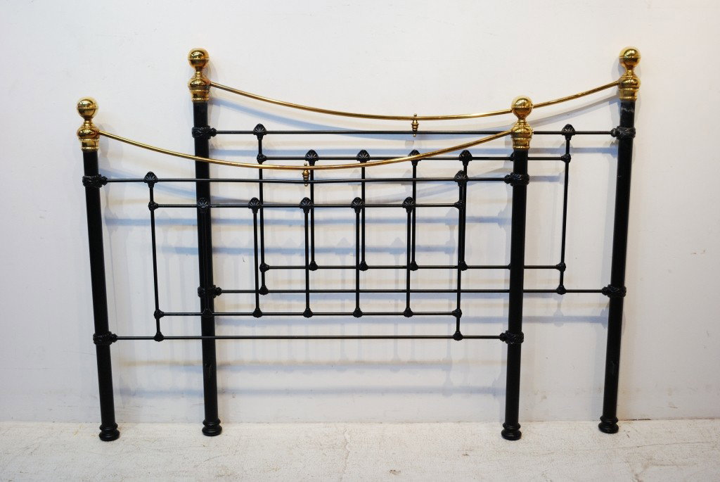 A VINTAGE IRON AND BRASS BED: A VINTAGE IRON AND BRASS BED length 79 inches; width 60 inches