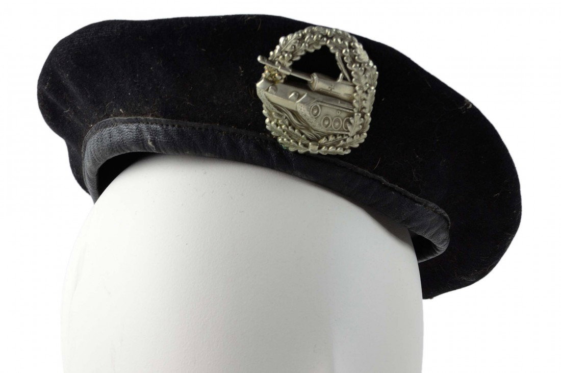 A GERMAN FELDMUTZE CAP, BLACK WOOL PANZER BADGE: A GERMAN FELDMUTZE CAP, BLACK WOOL PANZER BADGE 1 x 9 ½ x 9 ½ inches
