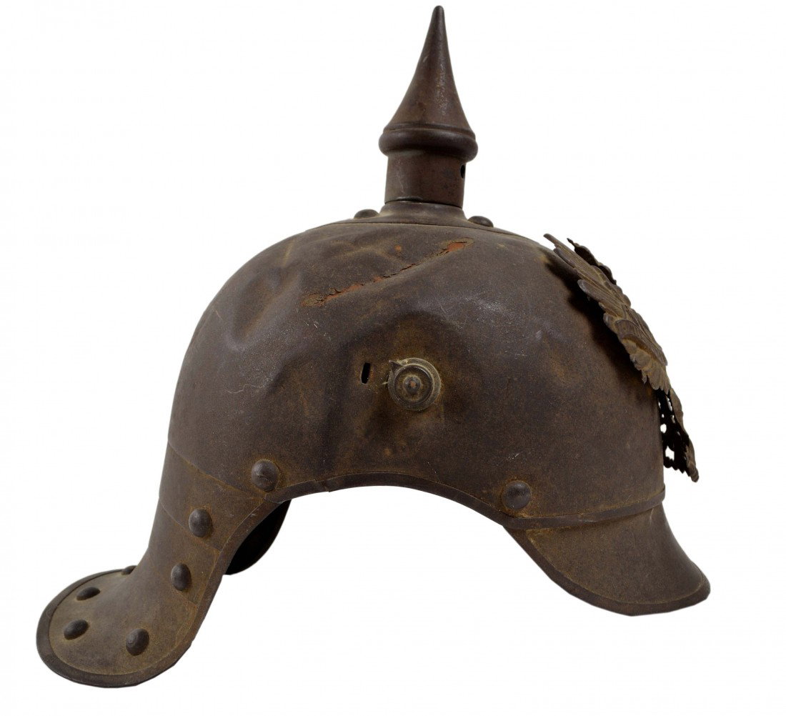 A WW1 PRUSSIAN SPIKED HELMET: A WW1 PRUSSIAN SPIKED HELMET 10 ½ x 7 ½ x 11 ½ inches