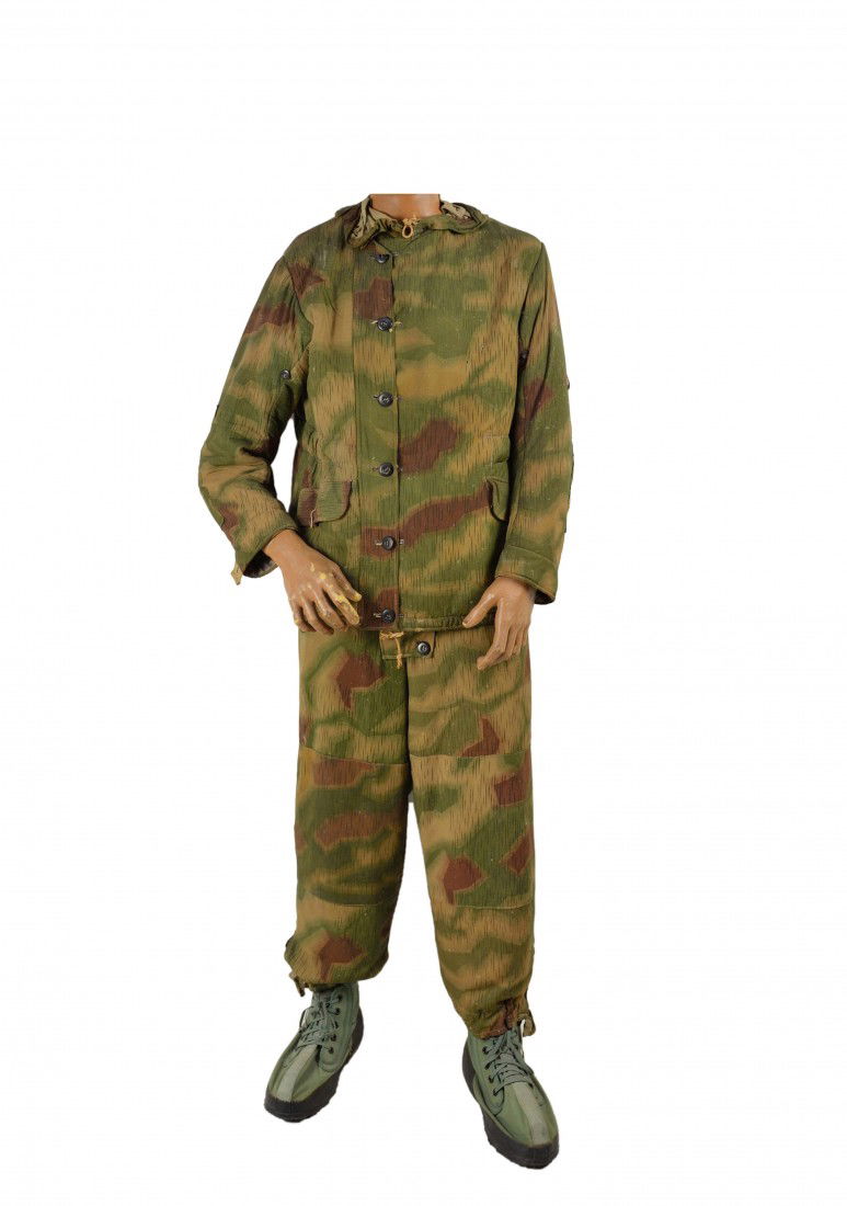 A GERMAN CAMOUFLAGE JACKET AND TROUSERS WITH JUNGLE: A GERMAN CAMOUFLAGE JACKET AND TROUSERS WITH JUNGLE STYLE BOOTS