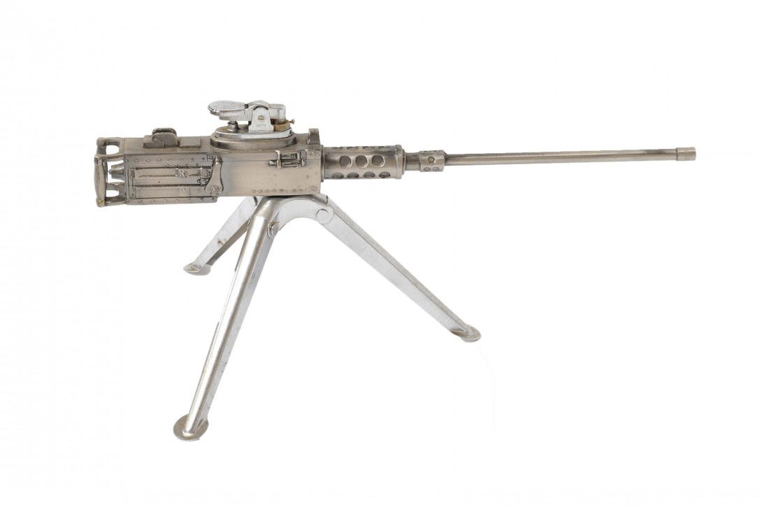 A TOY MACHINE GUN, SMALL TABLE LIGHTER: A TOY MACHINE GUN, SMALL TABLE LIGHTER 5 ½ x 12 x 7 inches