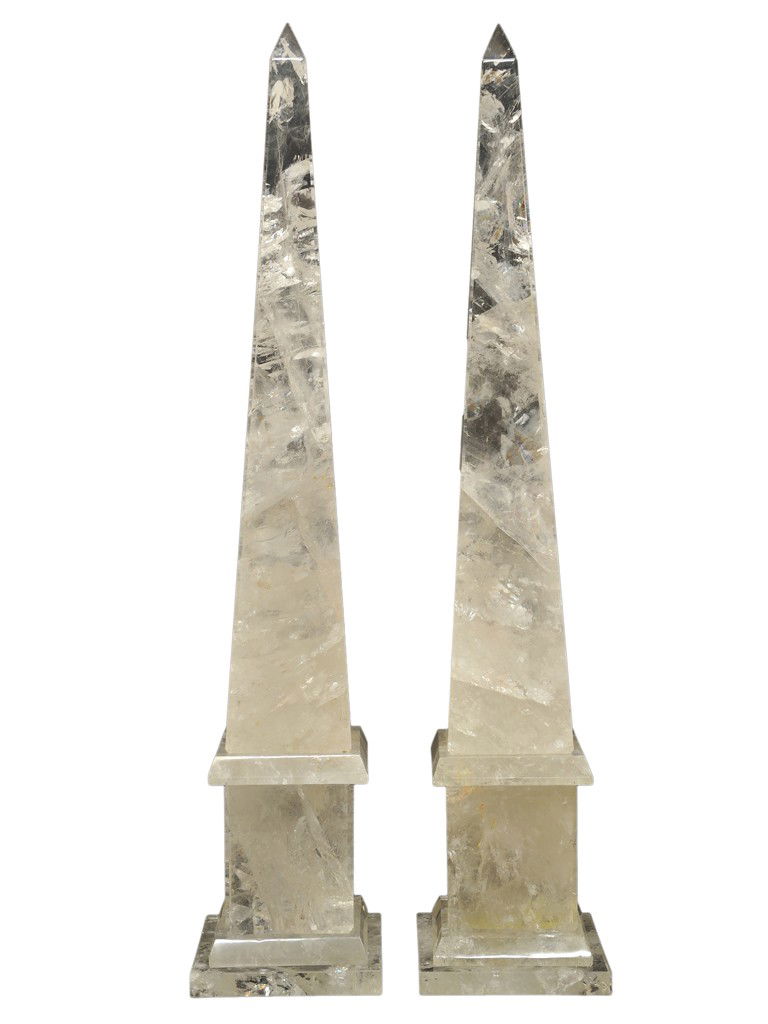 A PAIR OF LARGE ROCK CRYSTAL OBELISKS 20th Century: A PAIR OF LARGE ROCK CRYSTAL OBELISKS 20th Century Each obelisk made of five rock crystal pieces stacked vertically, the obelisk proper sitting on a rectangular block base that in turn rests on a low