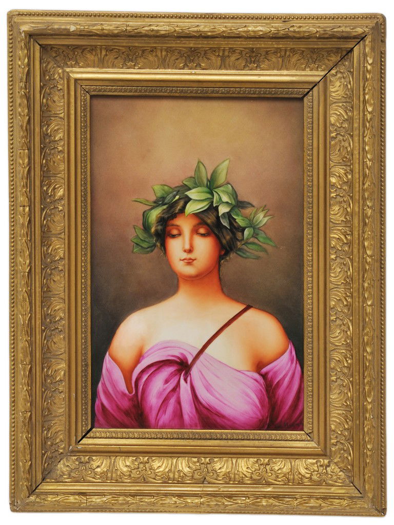A HANDPAINTED GILT FRAMED PORCELAIN PLAQUE Late 20: A HANDPAINTED GILT FRAMED PORCELAIN PLAQUE Late 20th Century The plaque bearing a spurious impressed KPM mark on verso, depicting a classical woman wearing a laurel leaf headdress; in an antique cast