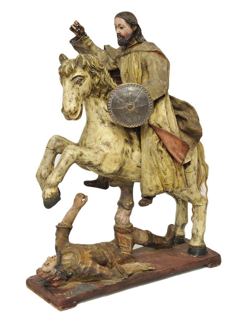 A SPANISH COLONIAL POLYCHROME WOOD FIGURE OF CHRIS: A SPANISH COLONIAL POLYCHROME WOOD FIGURE OF CHRIST ON A HORSE The painted wood figure of Christ depicted in an active pose mounted on a rearing white horse holding a sword or spear (now missing) tram