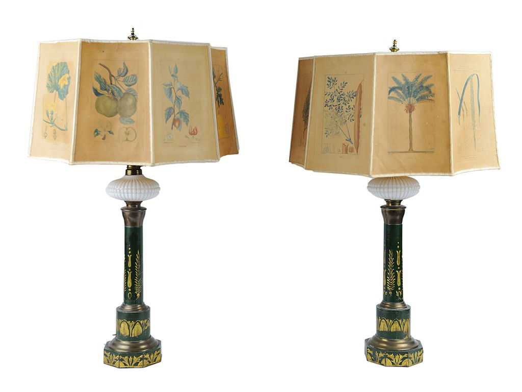 A PAIR OF OIL LAMPS WITH MILK GLASS FOUNTS AND HAN: A PAIR OF OIL LAMPS WITH MILK GLASS FOUNTS AND HAND-DECORATED TOLE SHADES France, 19th Century deep verde iron base with gold decoration converted to electricity; nine panel shade with botanical illus