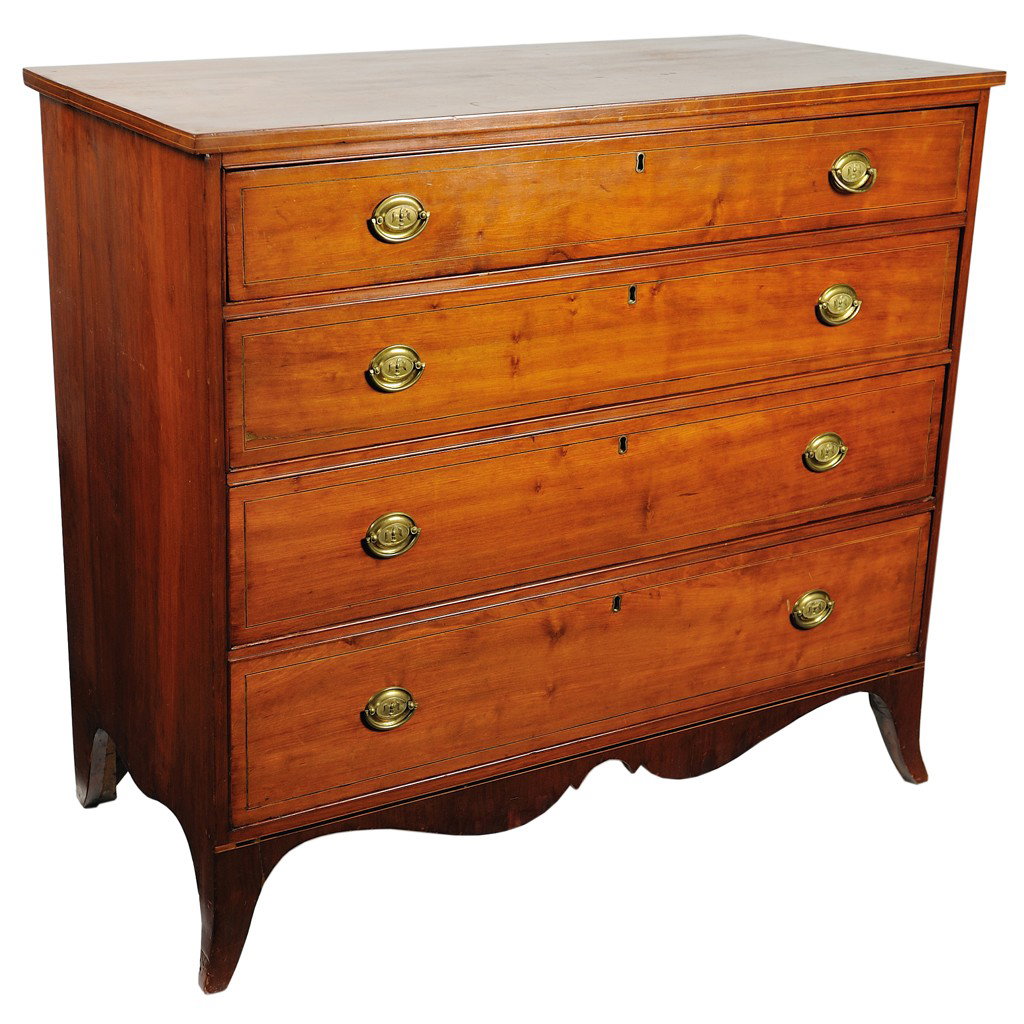 A SHERATON STYLE CHERRY CHEST WITH FOUR DRAWERS Am: A SHERATON STYLE CHERRY CHEST WITH FOUR DRAWERS American The provincial plank top is supported by a rectilinear body with four graduated drawers separated by dust shelves and adorned oval brass bail p