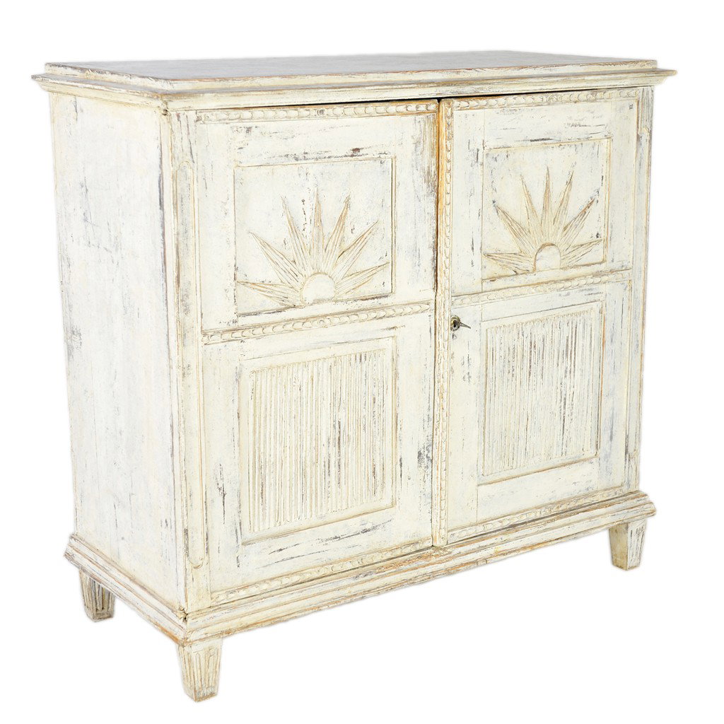 A SWEDISH TWO-DOOR PAINTED CABINET Late 19th Centu: A SWEDISH TWO-DOOR PAINTED CABINET Late 19th Century The plinth top with molded cornice is supported by a rectilinear body featuring a pair of locking doors (keys included) with chip carved frames and