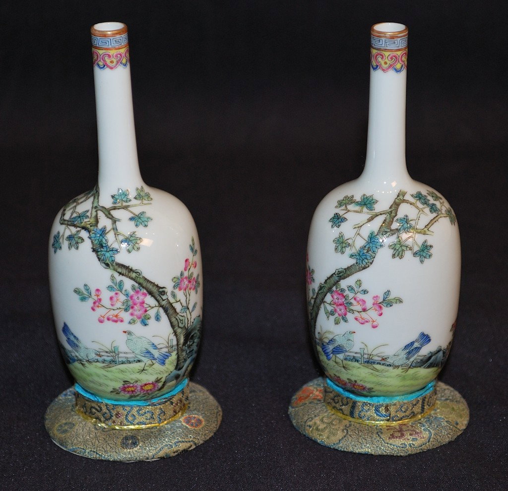 A PAIR OF CHINESE MINIATURE PORCELAIN VASES: A PAIR OF CHINESE MINIATURE PORCELAIN VASES Finely decorated with ming trees and birds. Note: one has been restored 5 ½ x 2 x 2 inches
