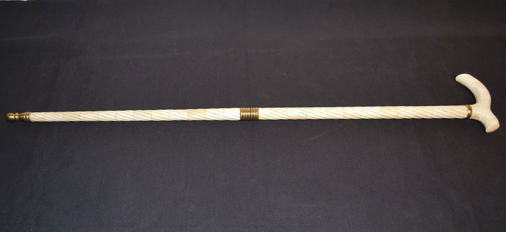 AN IVORY OR BONE VENEER WALKING STICK / CANE: AN IVORY OR BONE VENEER WALKING STICK / CANE 36 x 5 ½ x 1 inches
