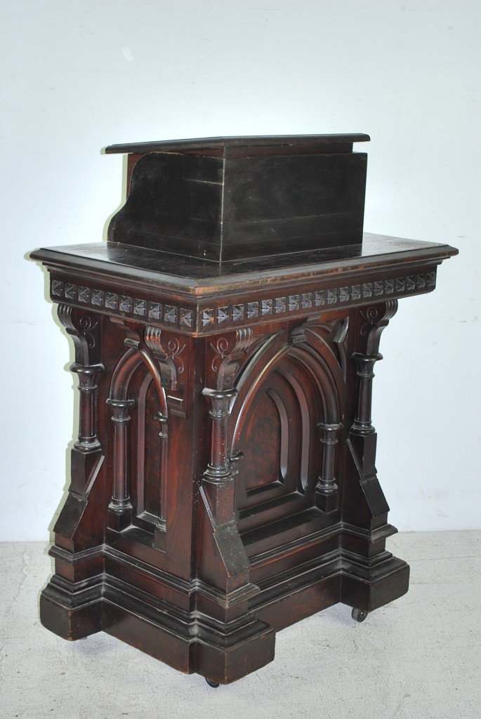 AN ANTIQUE GOTHIC REVIVAL FUMED OAK PULPIT: AN ANTIQUE GOTHIC REVIVAL FUMED OAK PULPIT Possibly removed from a church or masonic temple. Has an adjustable height top. 49½ X 37 X 21