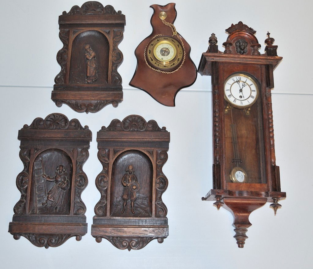 A GROUP OF WALL DECORATIVES: A GROUP OF WALL DECORATIVES this includes a Henry II style grandfather clock; a barometer decorated by the zodiac figures on the outside; and three carved wood panels consiststing of carved figures on