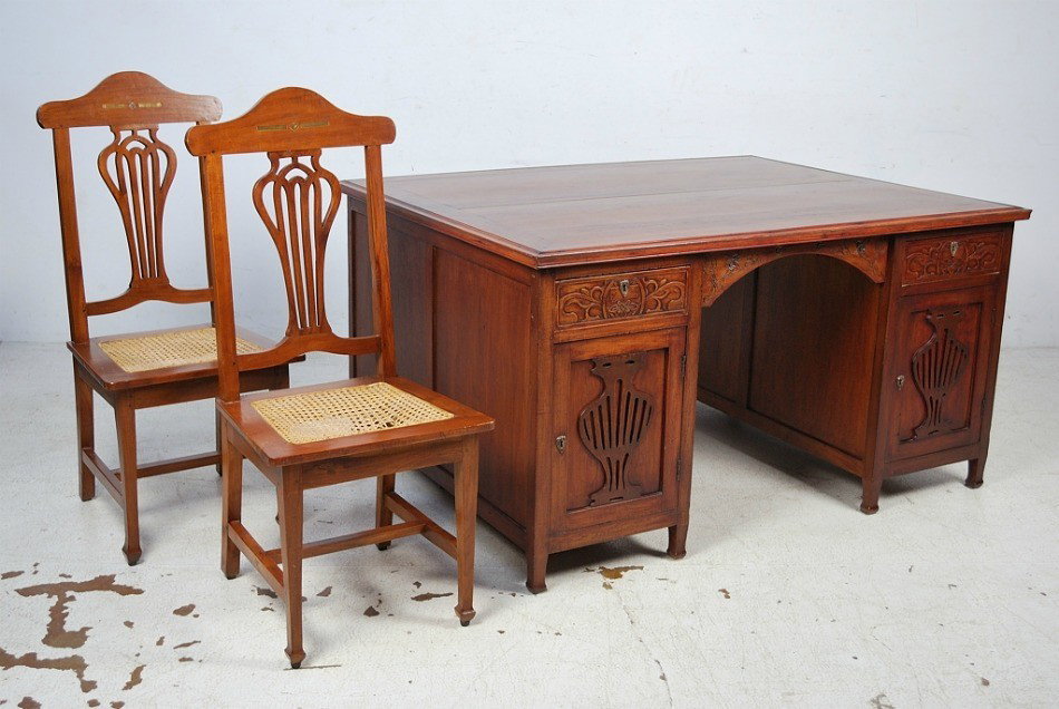 A MODERN DECORATIVE SE ASIAN PARTNERS DESK: A MODERN DECORATIVE SE ASIAN PARTNERS DESK Together with 2 associated side chairs. Purchased in 1994 in Singapore. Note: cane seating on side chairs is damaged. 44 X 58 X 30 inches