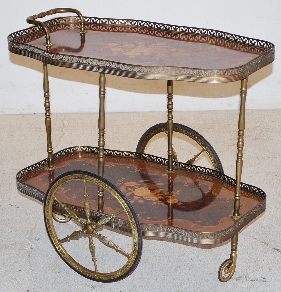A VINTAGE INLAID ITALIAN TEA CART: A VINTAGE INLAID ITALIAN TEA CART Mid 20th century. With a decorative brass gallery and wheels. 26 ½ x 28 x 17 inches