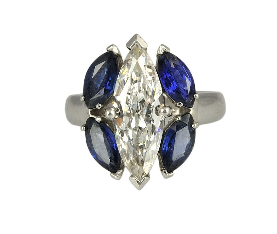 A PLATINUM DIAMOND & SAPPHIRE RING: A PLATINUM DIAMOND & SAPPHIRE RING One marquise = 2.00 Ct., Color-J, Clarity-SI2 and four marquise blue sapphires = 3.00 Ct. Size 7 1/4 . 10.7 grams. Weight, color, and clarity determined while center